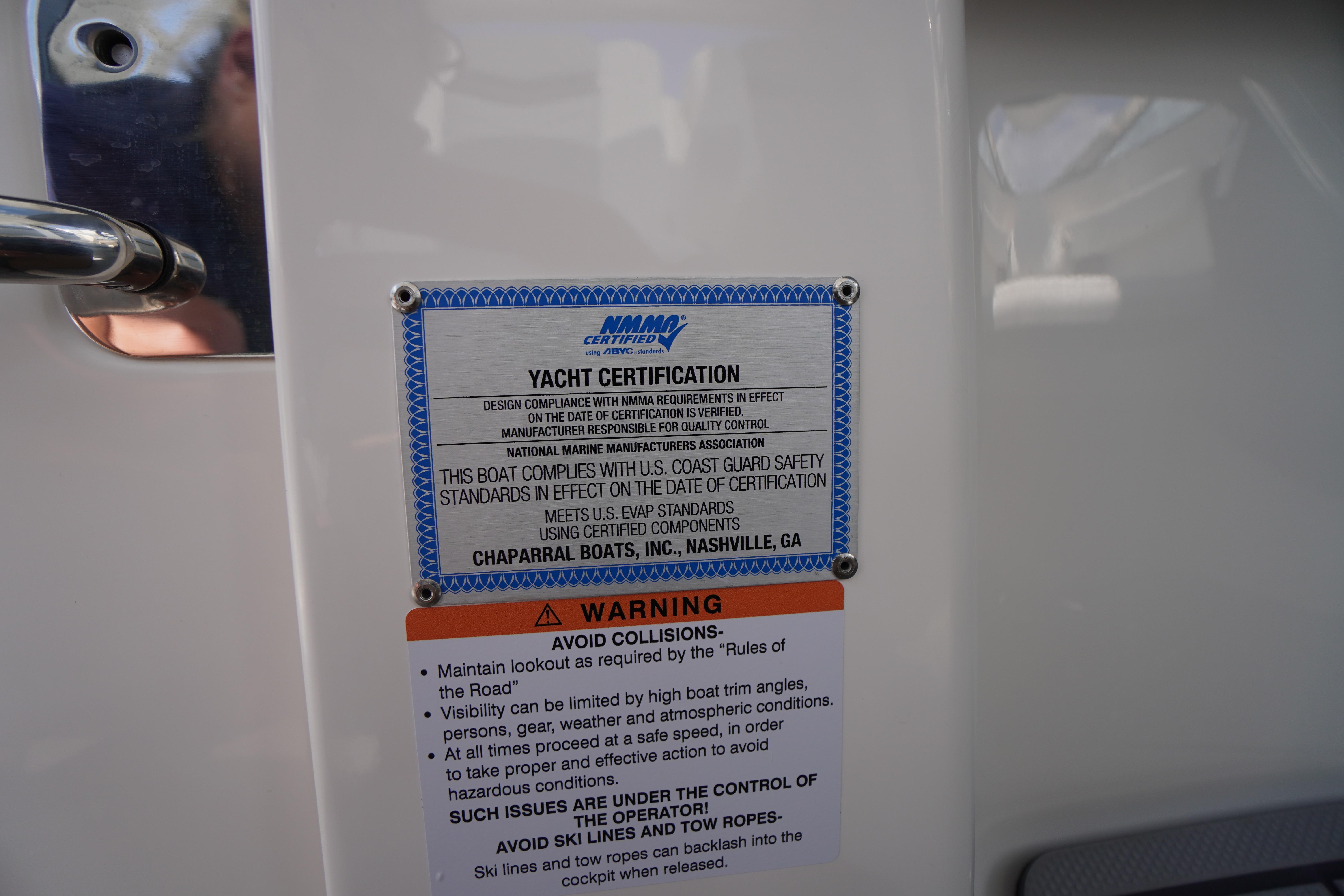 Slide: The Image of Yacht certification and safety warning labels on 2025 Chaparral 280 OSX boat. - 31