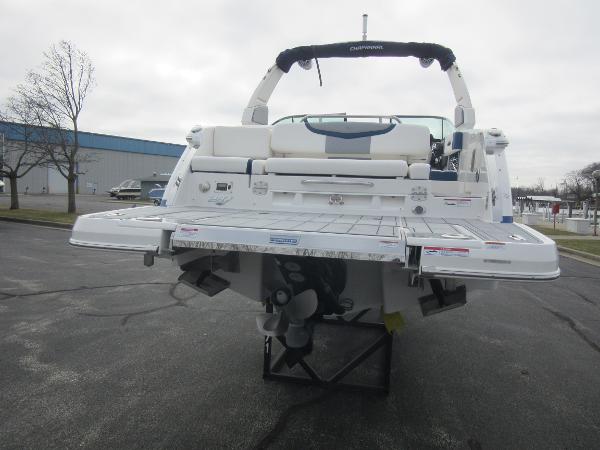 Slide: The Image of 2024 Chaparral 287 SSX boat rear view with swim platform and outboard motor. - 10