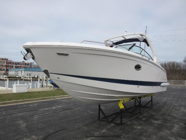 Slide: The Image of 2024 Chaparral 287 SSX boat on display at a marina. - 11