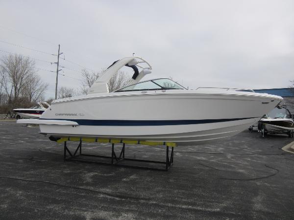Slide: The Image of 2024 Chaparral 287 SSX boat on display in a parking lot. - 8
