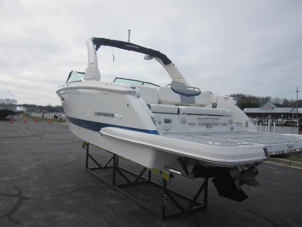 Slide: The Image of 2024 Chaparral 287 SSX boat on display in a marina. - 9