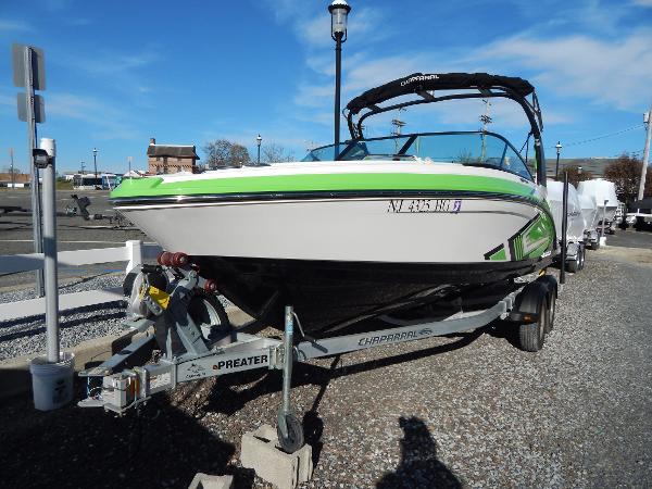 Slide: The Image of 2015 Chaparral Vortex 223 VRX boat on a trailer in a marina. - 1