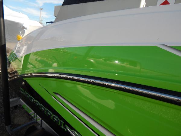 Slide: The Image of 2015 Chaparral Vortex 223 VRX boat with vibrant green and white exterior. - 11
