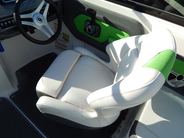 Slide: The Image of 2015 Chaparral Vortex 223 VRX boat interior with white and green captain's chair. - 20