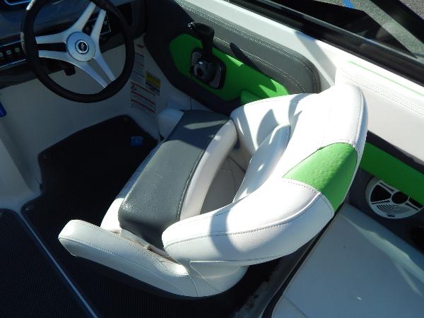 Slide: The Image of 2015 Chaparral Vortex 223 VRX boat interior with white and green seating. - 21