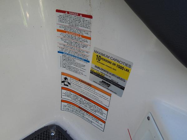 Slide: The Image of 2015 Chaparral Vortex 223 VRX capacity and warning labels. - 22