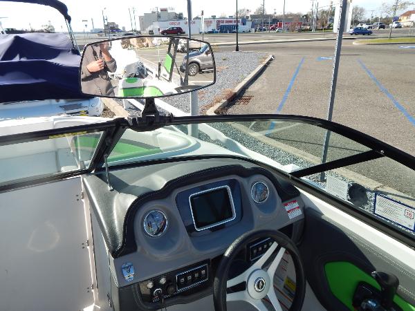 Slide: The Image of 2015 Chaparral Vortex 223 VRX boat dashboard and steering wheel. - 25