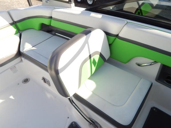 Slide: The Image of 2015 Chaparral Vortex 223 VRX boat interior with green and white seating. - 26