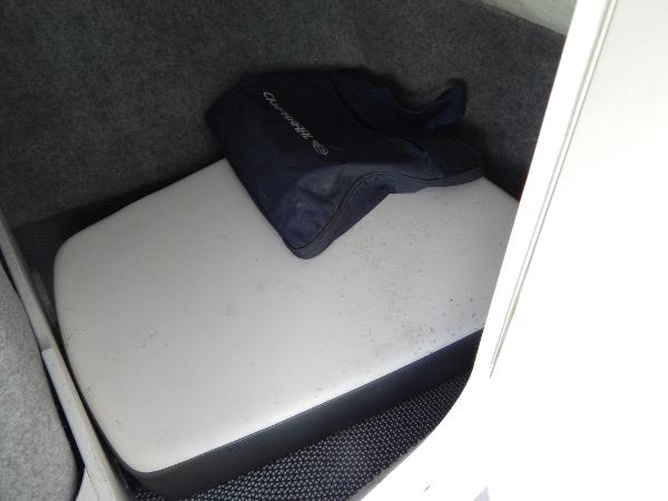 Slide: The Image of Storage compartment in 2015 Chaparral Vortex 223 VRX boat with cushion and bag. - 28