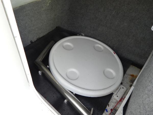 Slide: The Image of Storage compartment in 2015 Chaparral Vortex 223 VRX boat with round table and metal frame. - 29