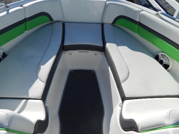 Slide: The Image of 2015 Chaparral Vortex 223 VRX boat interior with green and white seating. - 33