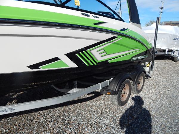 Slide: The Image of 2015 Chaparral Vortex 223 VRX boat with green and black graphics on trailer. - 4