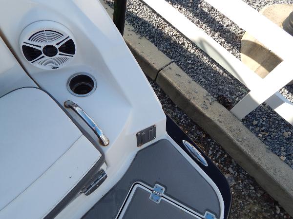Slide: The Image of 2015 Chaparral Vortex 223 VRX boat interior detail with speaker and cup holder. - 40