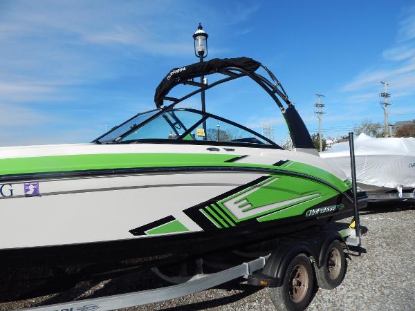 Slide: The Image of 2015 Chaparral Vortex 223 VRX boat with green and black accents on a trailer. - 42