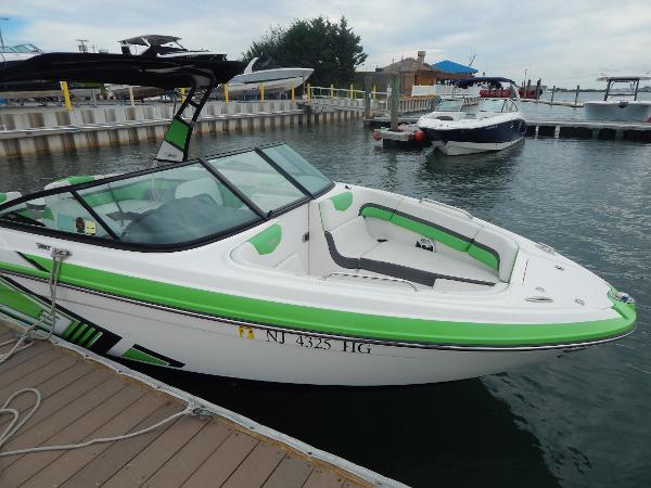 Slide: The Image of 2015 Chaparral Vortex 223 VRX boat docked at marina. - 47