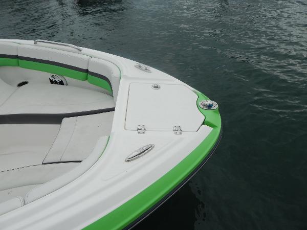 Slide: The Image of 2015 Chaparral Vortex 223 VRX boat bow with green and white seating. - 49