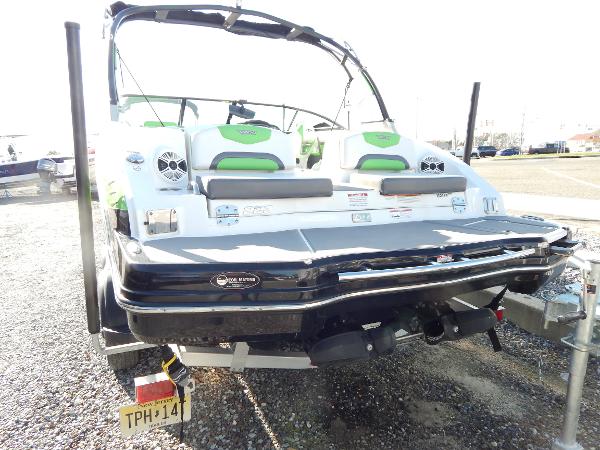 Slide: The Image of 2015 Chaparral Vortex 223 VRX boat rear view with green accents. - 7