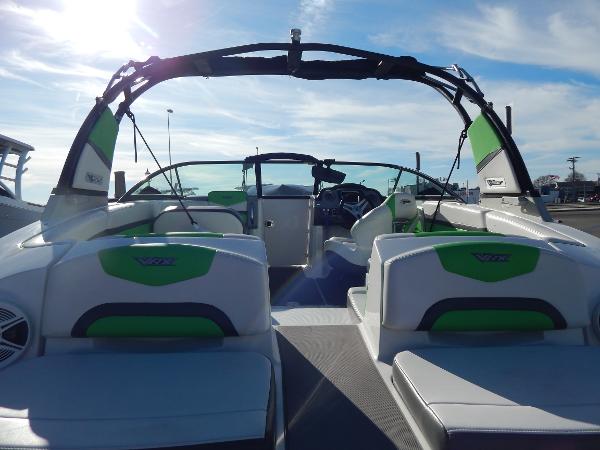 Slide: The Image of 2015 Chaparral Vortex 223 VRX boat interior with green and white seating. - 8