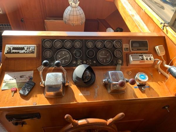 Slide: The Image of Control panel of a 1984 CHB 48 boat with gauges and navigation equipment. - 18