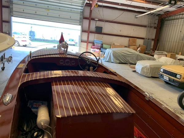 Slide: The Image of 1947 Chris-Craft 17 Runabout Deluxe in a storage garage. - 4