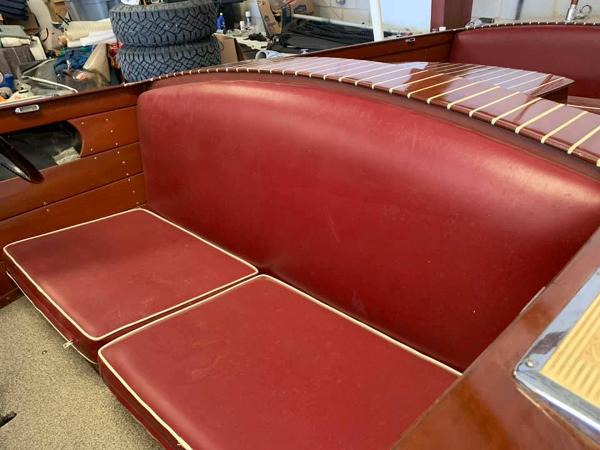 Slide: The Image of 1947 Chris-Craft 17 Runabout Deluxe with red leather seats and wooden interior. - 7