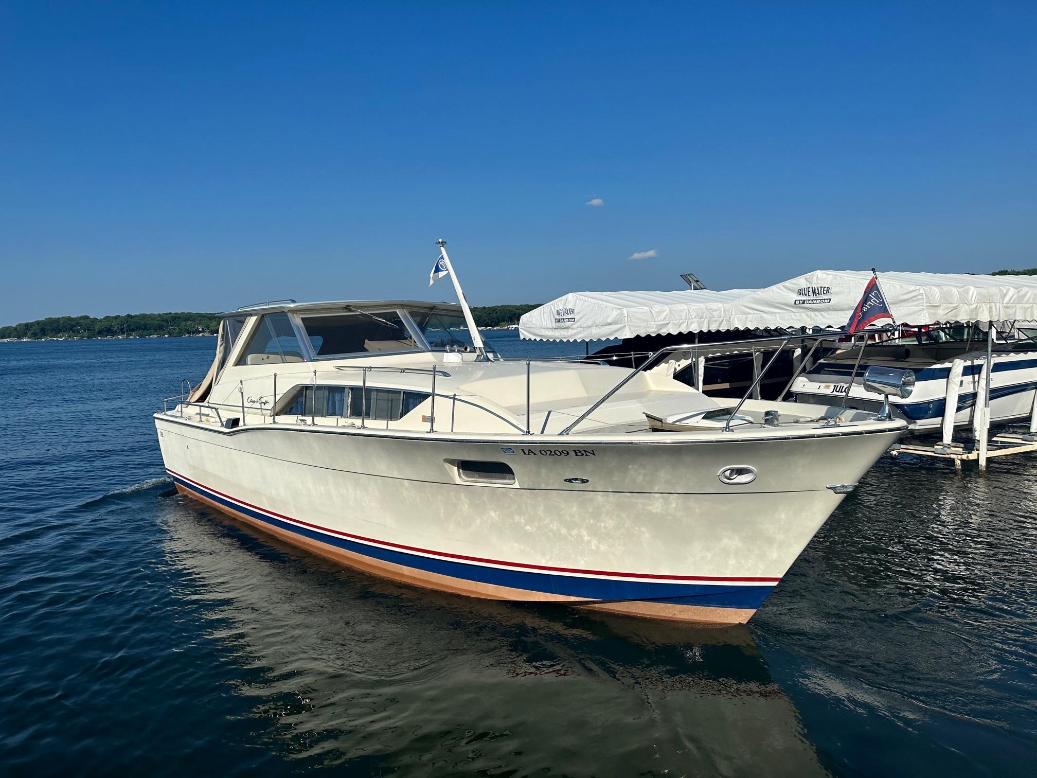 Slide: The Image of 1968 Chris-Craft 35 Commander boat docked on a sunny day. - 0
