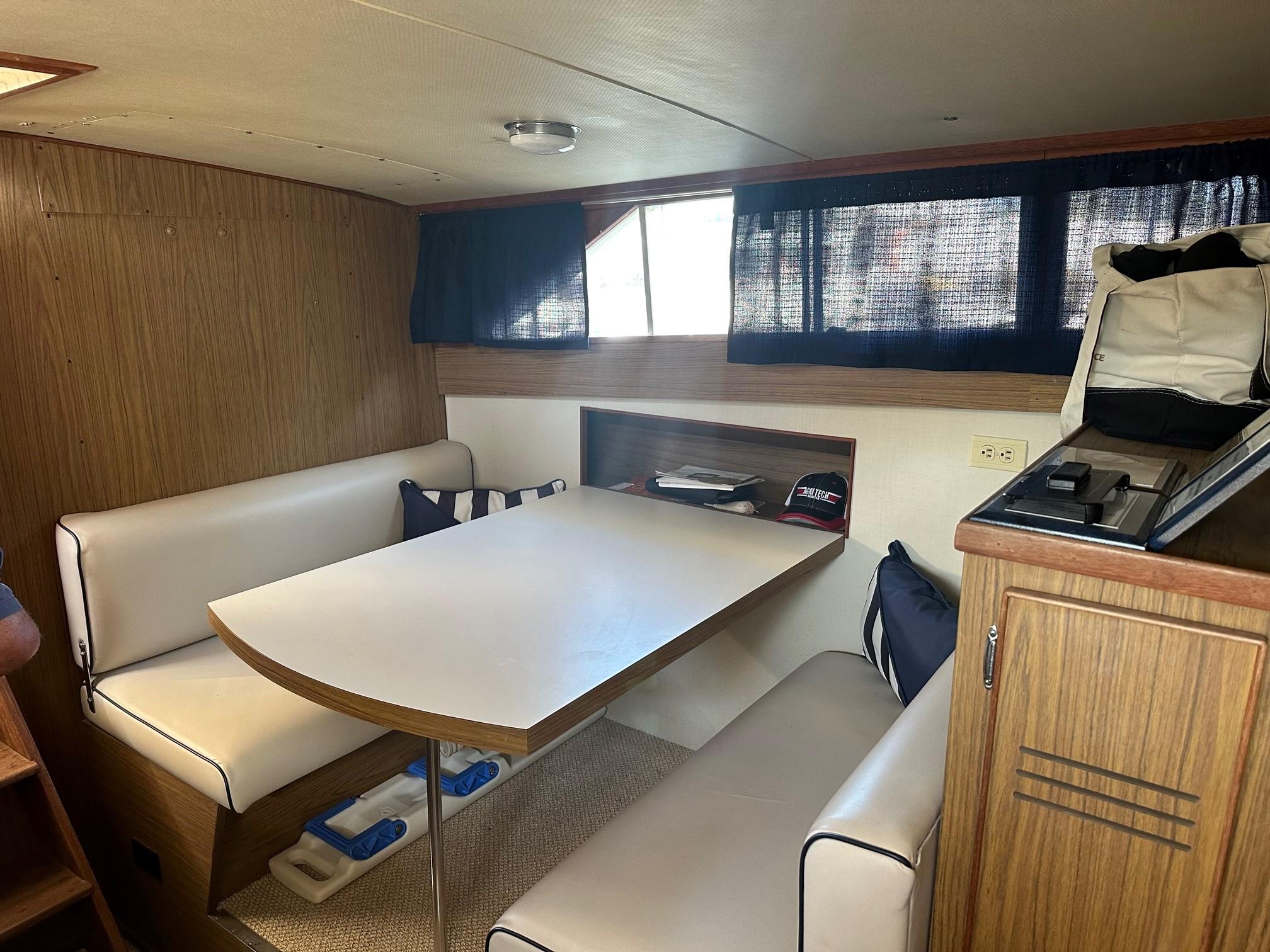 Slide: The Image of Interior of 1968 Chris-Craft 35 COMMANDER with dining area and wood paneling. - 19
