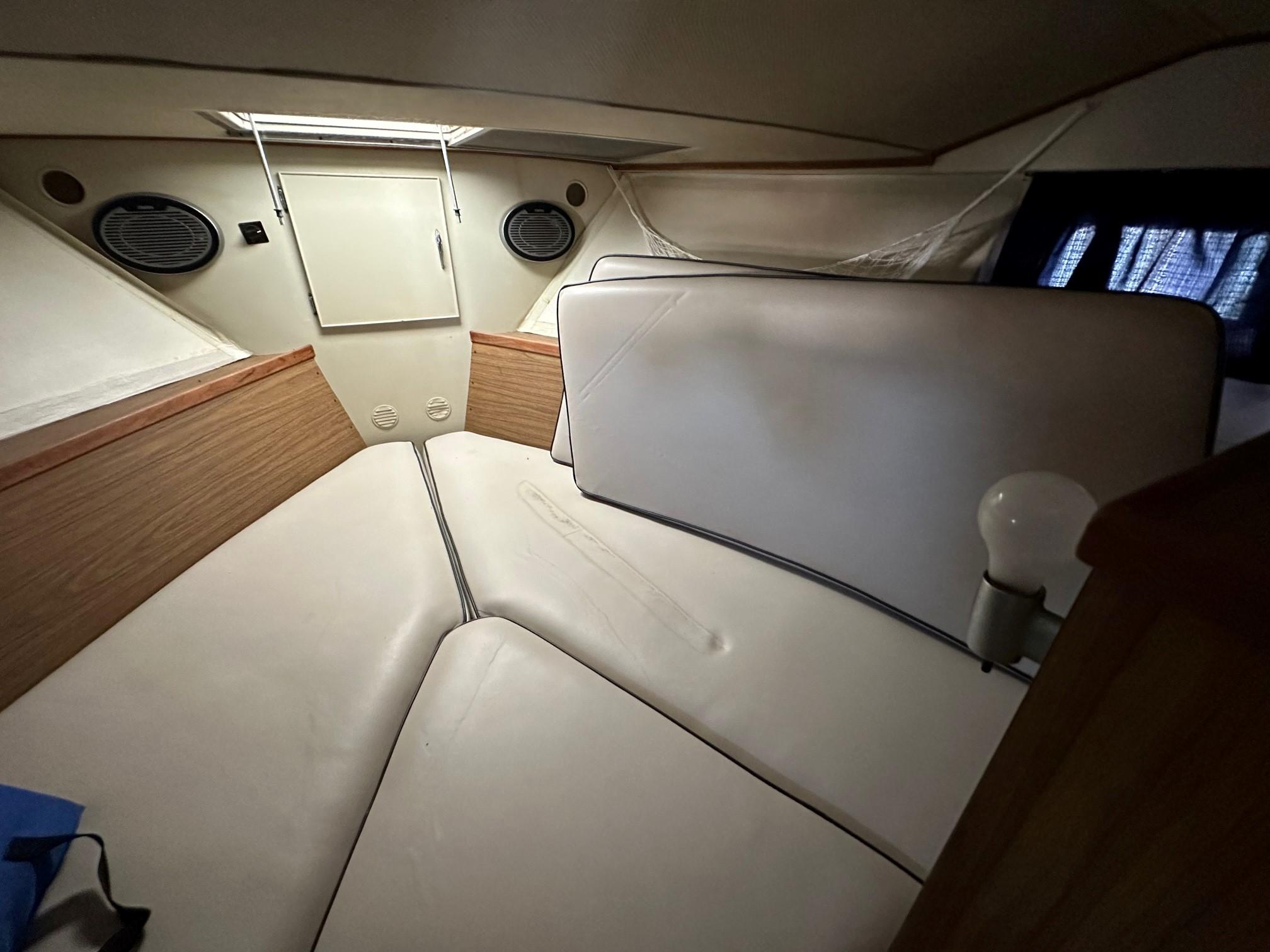 Slide: The Image of Interior cabin of a 1968 Chris-Craft 35 Commander boat with cushioned seating. - 21