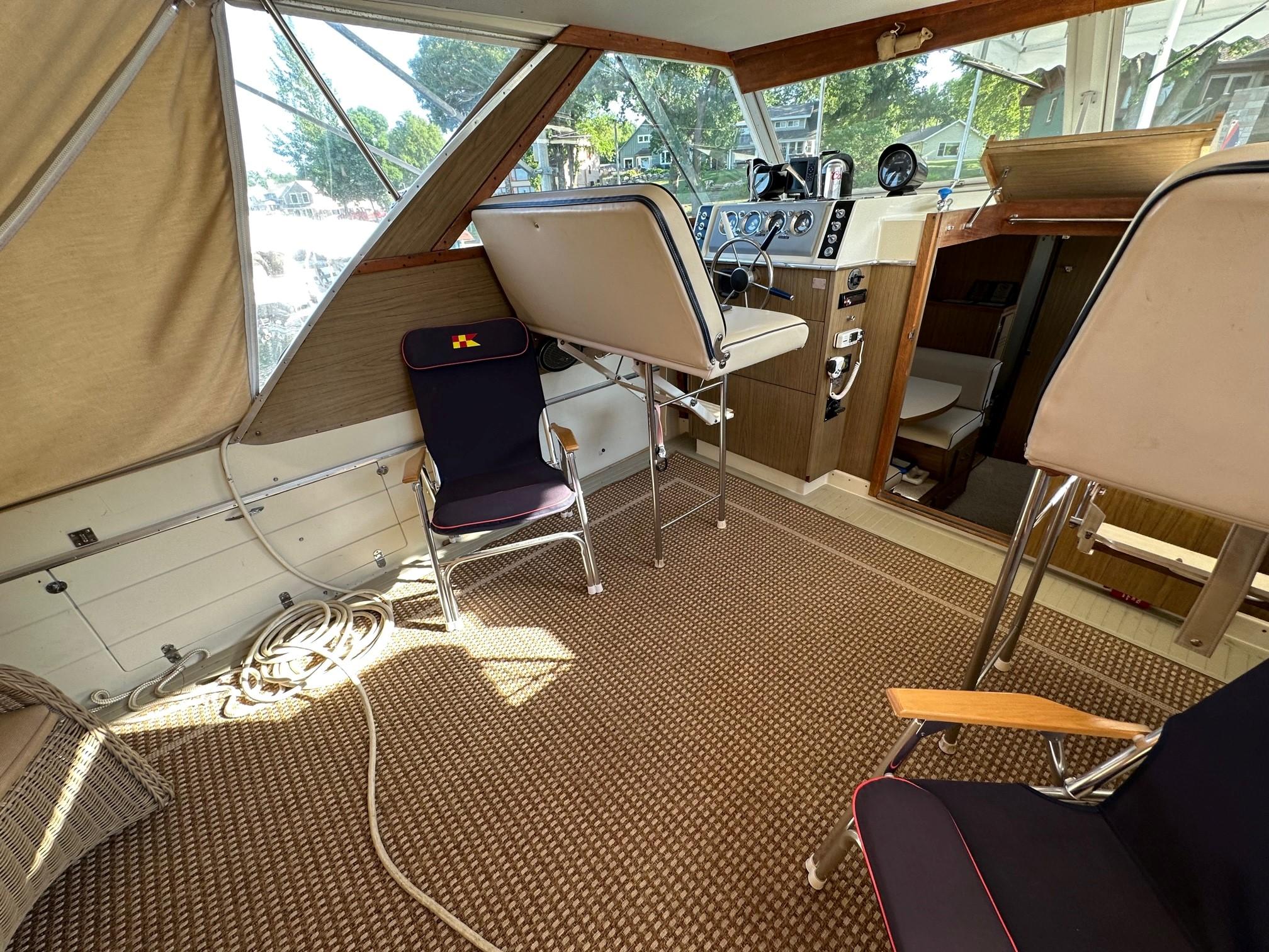 Slide: The Image of Interior of 1968 Chris-Craft 35 Commander boat with seating and control panel. - 25