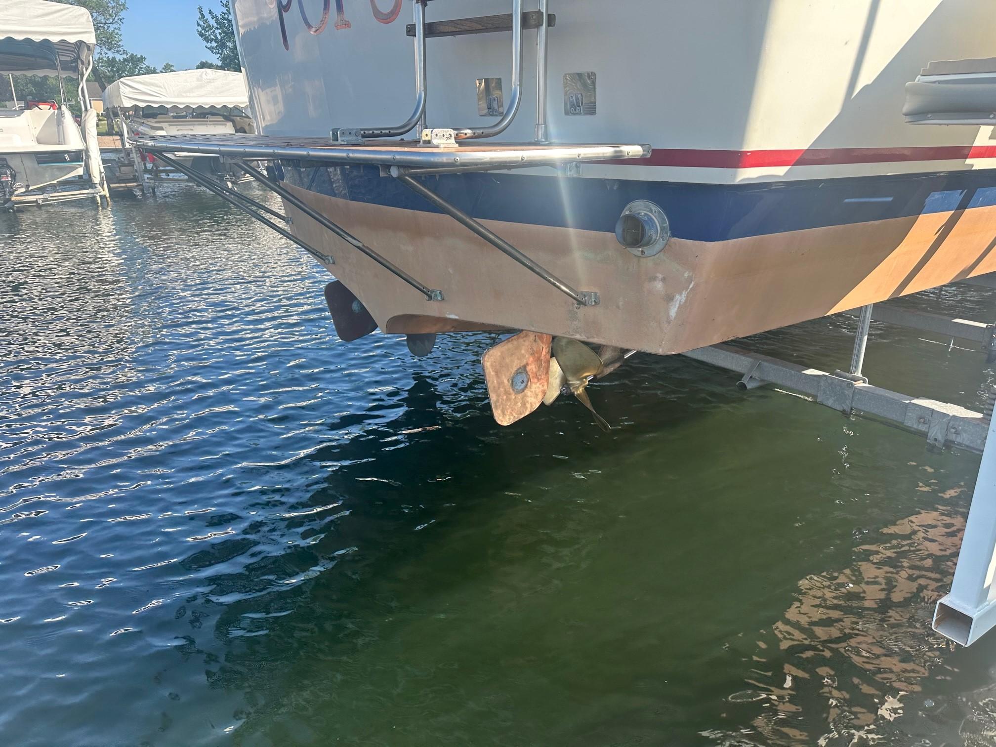 Slide: The Image of 1968 Chris-Craft 35 Commander boat stern view in marina. - 27