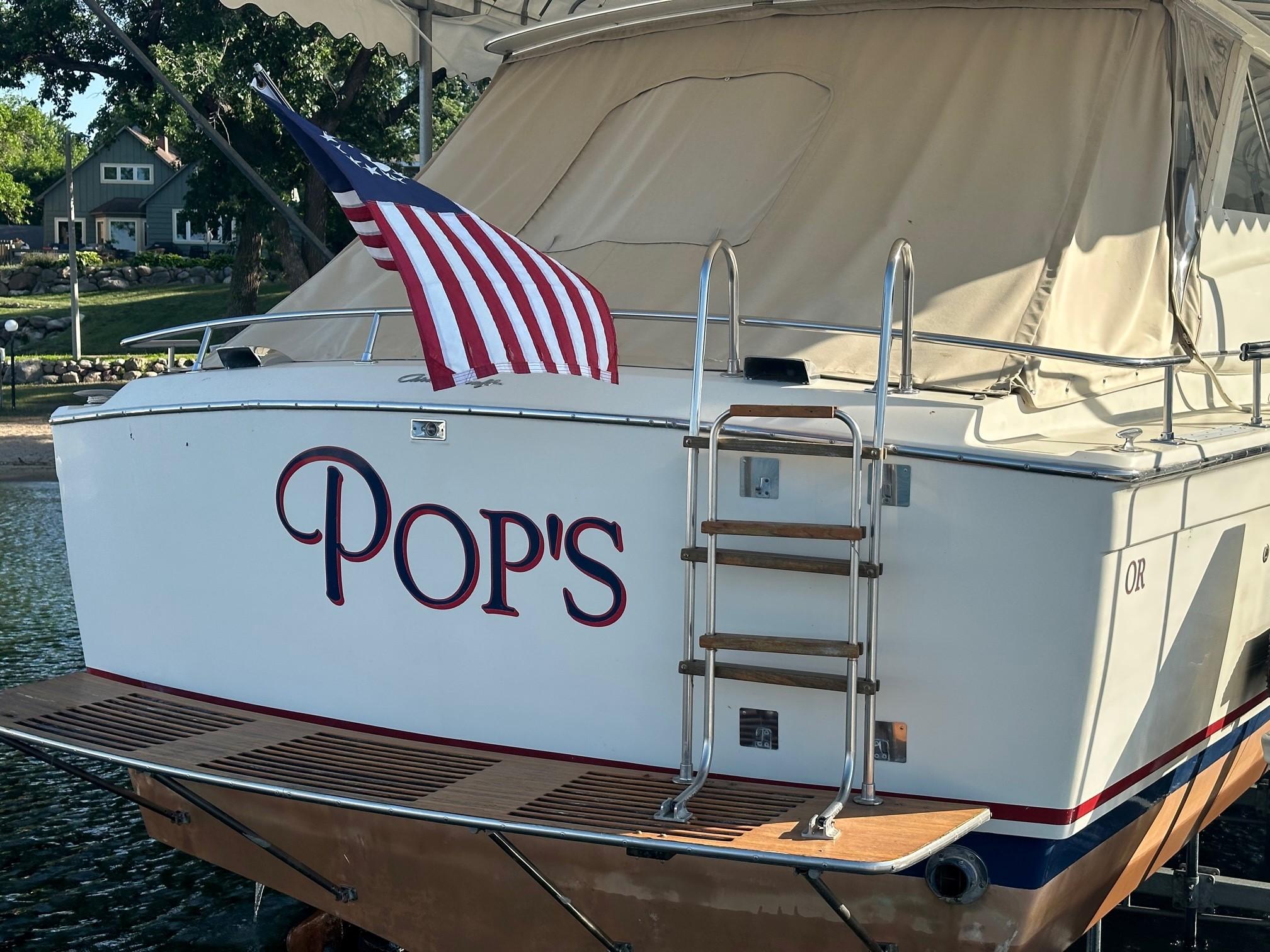 Slide: The Image of 1968 Chris-Craft 35 COMMANDER boat named Pop's with American flag on stern. - 32