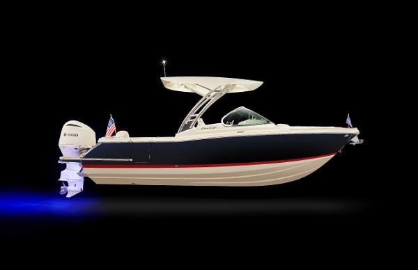 Slide: The Image of 2024 Chris-Craft Calypso 24 boat with sleek design and powerful outboard motor. - 1