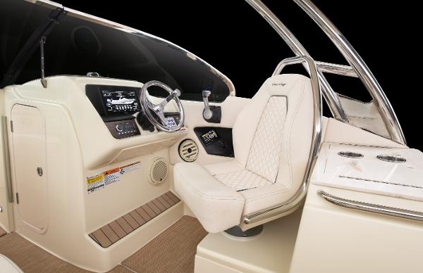 Slide: The Image of 2024 Chris-Craft Calypso 24 helm station with luxurious seating and modern controls. - 2