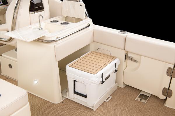Slide: The Image of 2024 Chris-Craft Calypso 24 boat interior with sink and cooler. - 4