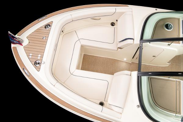 Slide: The Image of 2024 Chris-Craft Calypso 24 boat interior, featuring luxurious seating and teak accents. - 5