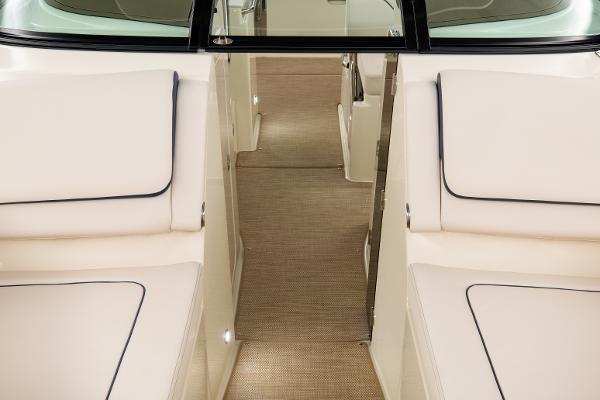 Slide: The Image of 2024 Chris-Craft Calypso 24 interior seating and walkway. - 6