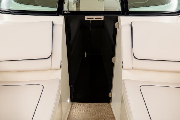 Slide: The Image of 2024 Chris-Craft Calypso 24 interior seating and cabin entrance. - 7