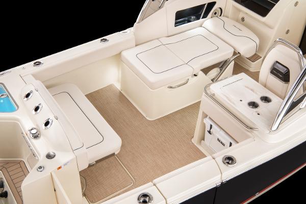 Slide: The Image of 2024 Chris-Craft Calypso 24 boat interior with seating and storage compartments. - 8