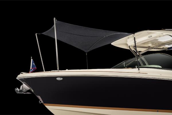 Slide: The Image of 2023 Chris-Craft Calypso 27 boat with black hull and sunshade. - 21