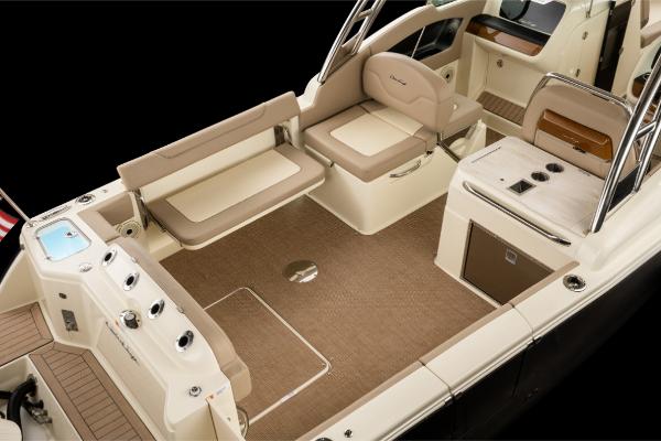 Slide: The Image of 2023 Chris-Craft Calypso 27 boat interior with beige seating and modern amenities. - 5