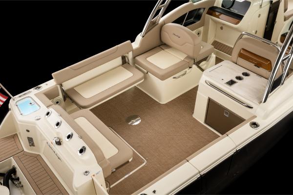 Slide: The Image of 2023 Chris-Craft Calypso 27 boat interior with beige seating and modern amenities. - 6