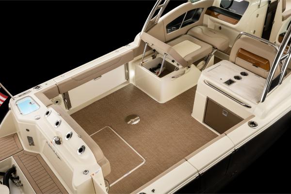 Slide: The Image of 2023 Chris-Craft Calypso 27 boat interior with seating and storage compartments. - 7