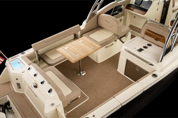 Slide: The Image of 2023 Chris-Craft Calypso 27 boat interior with seating and table. - 9