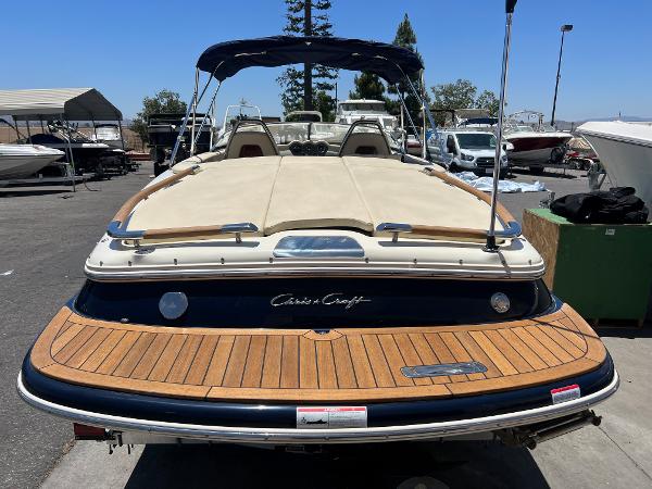 Slide: The Image of 2020 Chris-Craft Capri 21 boat with teak swim platform and beige upholstery. - 8