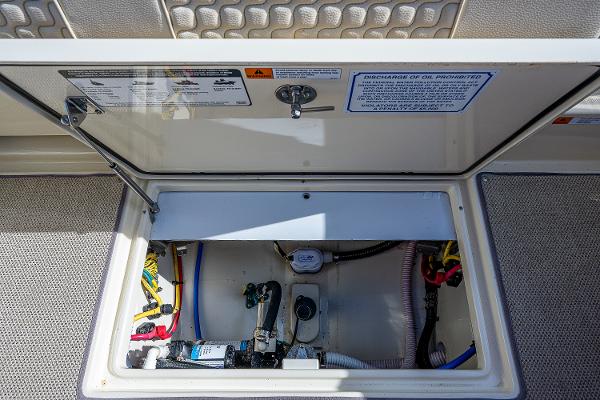 Slide: The Image of 2019 Chris-Craft Catalina 27 engine compartment with wiring and components visible. - 28