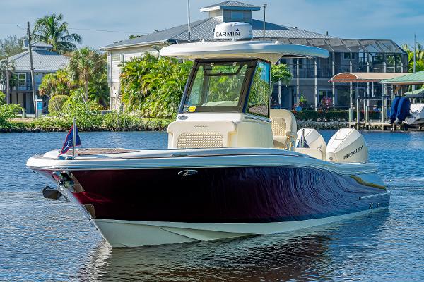 Slide: The Image of 2019 Chris-Craft Catalina 27 boat on water, featuring sleek design and Garmin equipment. - 3