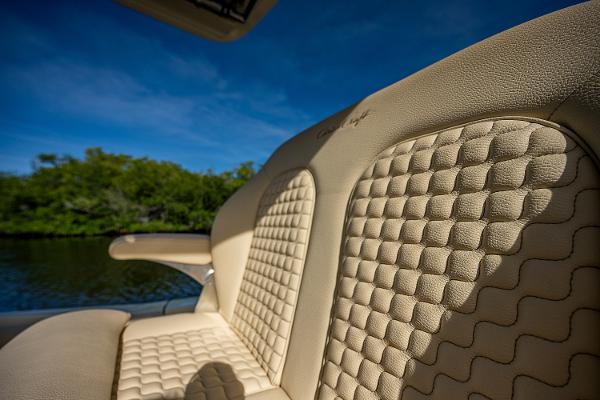 Slide: The Image of Luxurious seating on 2019 Chris-Craft Catalina 27 boat with quilted upholstery. - 38