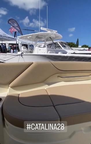 Slide: The Image of 2024 Chris-Craft Catalina 28 boat at a marina, hashtag #Catalina28. - 10