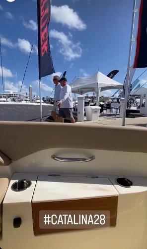 Slide: The Image of 2024 Chris-Craft Catalina 28 at a boat show with #Catalina28 hashtag. - 12