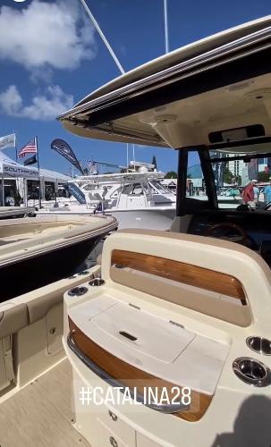 Slide: The Image of 2024 Chris-Craft Catalina 28 boat at a marina, showcasing luxury seating and amenities. #Catalina28 - 8